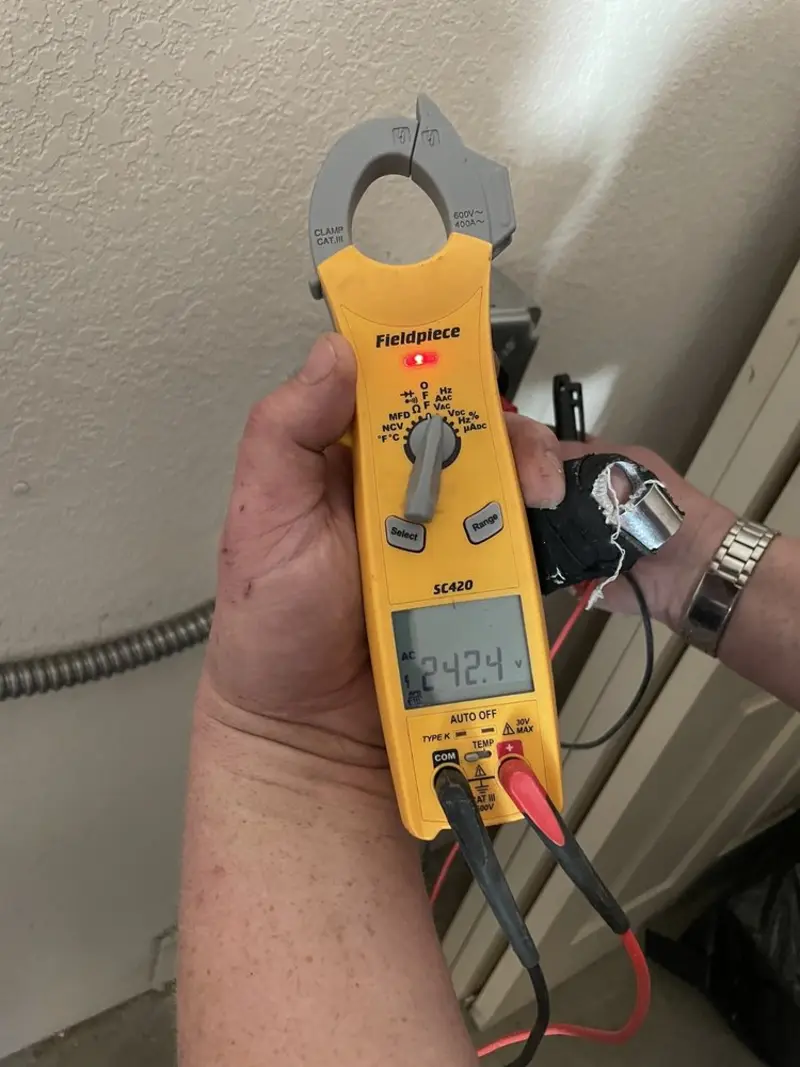 Voltage testing with clamp meter during Ceiling Fan Installation in Three Oaks